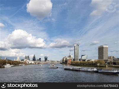 Beautiful landscape image view from Waterloo bridge along River . UK. Landscape image view from Waterloo bridge along River Thames towards financial district in London