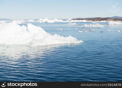 Beautiful Landscape in Greenland with mountains, Icebergs and blue Sky