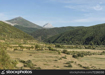 Beautiful landscape in Spain with dramatic view of Cantabrian Mountains. Dry riverbed on the bottom of canyon