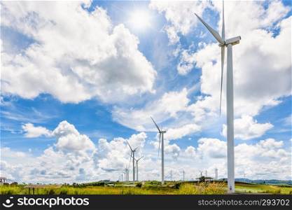 Beautiful landscape many windmills under the sun on blue sky and clouds background, Clean energy that is environmentally friendly at Khao Kho, Phetchabun, Thailand. Landscape windmills under the sun