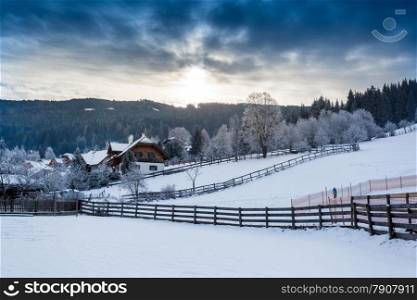 Beautiful landscape of Alpine town in mountains covered in snow