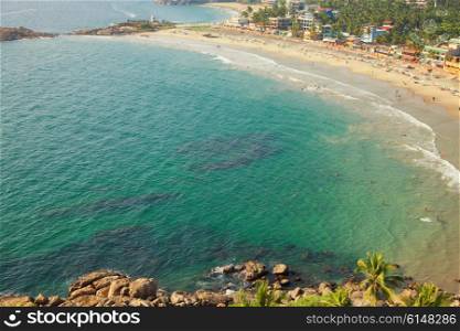 Beautiful landscape of beach and clear turquoise sea. Thiruvananthapuram, India