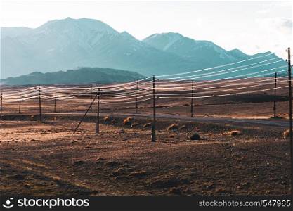 beautiful landscape of electric wires gleaming in the sun on the hills background.. beautiful landscape of electric wires gleaming in the sun on the hills background