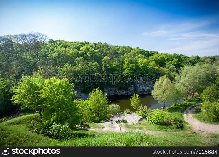 Beautiful landscape of forest, river and deep blue sky