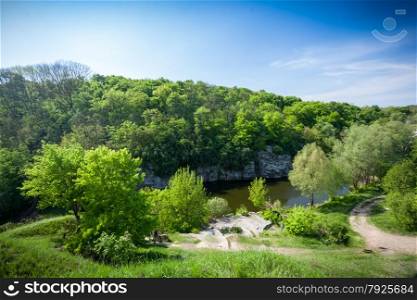 Beautiful landscape of forest, river and deep blue sky