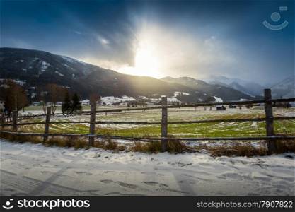 Beautiful landscape of highland farm in Austrian Alps at sunset