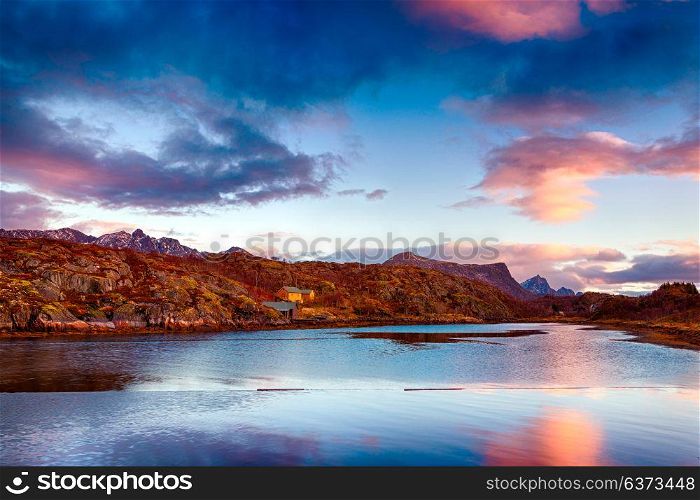 Beautiful landscape of Kabelvag, amazing view of a mountains in sunset light which reflecting in the lake, gorgeous nature of fisherman&rsquo;s town, Norway