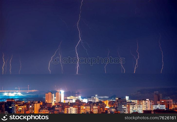 Beautiful landscape of lightning among the dark blue sky above the night city, thunderstorm