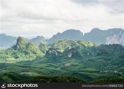 beautiful landscape of mountain with cloudy sky and greenery in rainy season at Doi Tapang, Sawi District, Chumphon, Thailand.