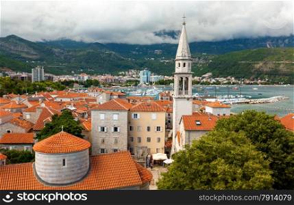 Beautiful landscape of old city with red roofs and high tower