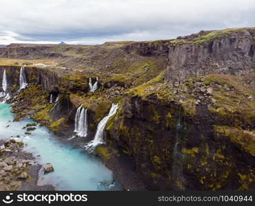 Beautiful landscape of Sigoldugljufur canyon with many small waterfalls and the blue river in Highlands of Iceland