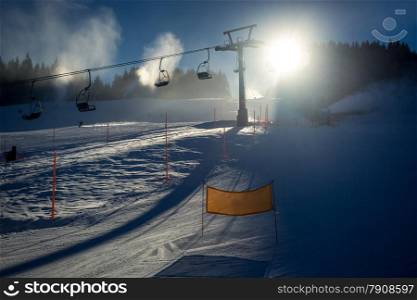 Beautiful landscape of ski slope with chairlifts at sunny day