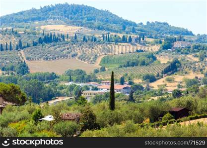 Beautiful landscape of Tuscany summer countryside from Pienza town walls. Typical for the Italy region Toscana hills, wheat field, olives garden, vineyards, cypress passes.
