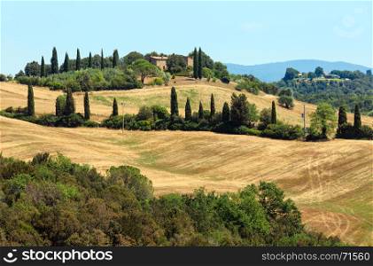 Beautiful landscape of Tuscany summer countryside in Italy. Typical for the region Toscana hills with wheat field.