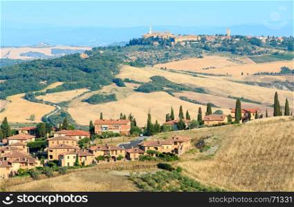 Beautiful landscape of Tuscany summer morning countryside in Montepulciano region. Typical for the Italy region Toscana farm houses, hills, wheat field, olives garden, vineyards, cypress passes.