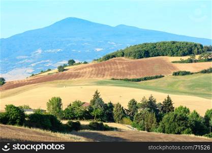 Beautiful landscape of Tuscany summer morning countryside in Montepulciano region. Typical for the Italy region Toscana hills, wheat field.