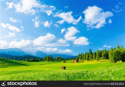Beautiful landscape of valley in Alpine mountains, small houses in Seefeld, rural scene, majestic picturesque view in sunny day
