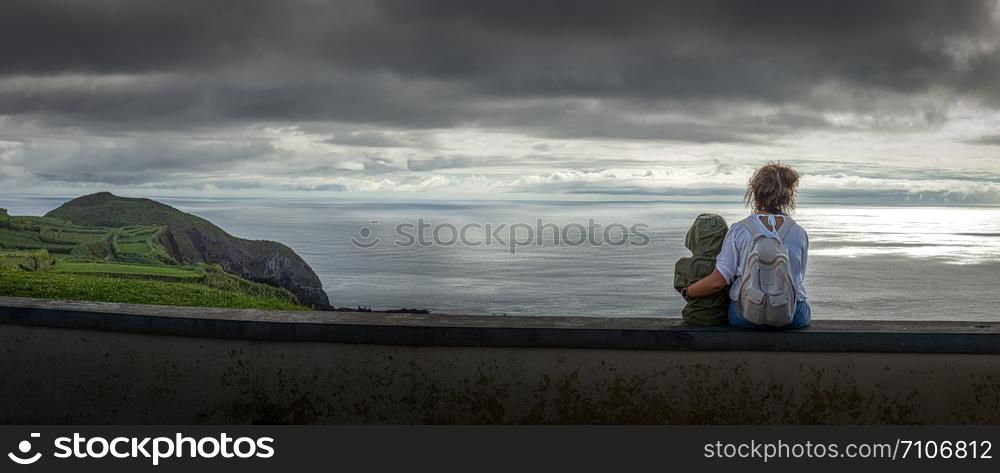 Beautiful landscape on the Atlantic Ocean with mother and child in the foreground