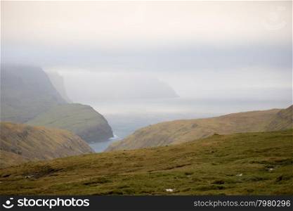 Beautiful landscape on the Faroe Islands, with green grass and mountains