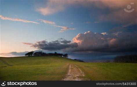Beautiful landscape over agricultural fields with moody sky and invigorating sunlight