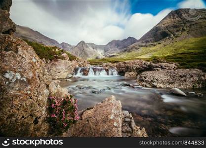 Beautiful landscape scenery with waterfalls in the mountains: The Fairy Pools, Isle of Skye, Scotland