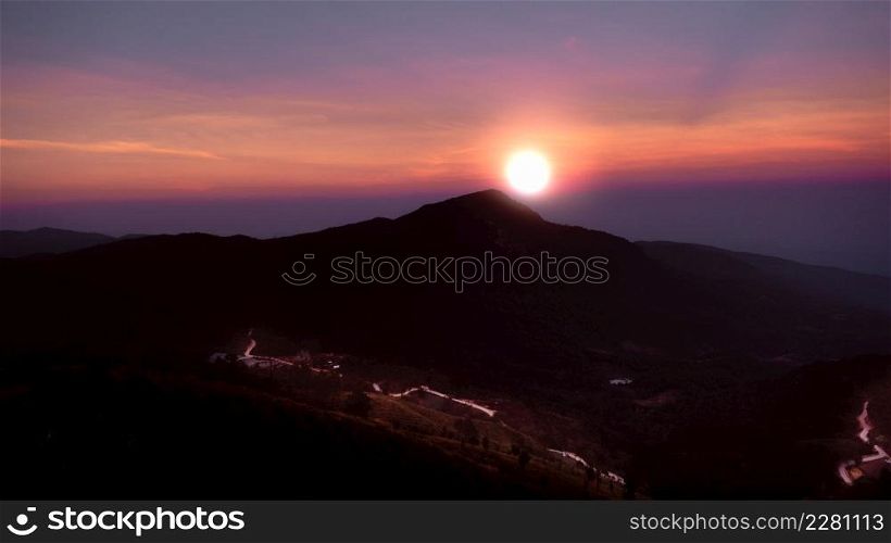 Beautiful landscape silhouette on the mountain peak during sunset with warm sunlight and dramatic sky.