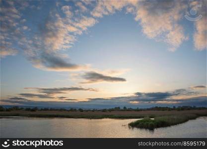 Beautiful landscape sunset image of Somerset Levels wetlands in England during Spring
