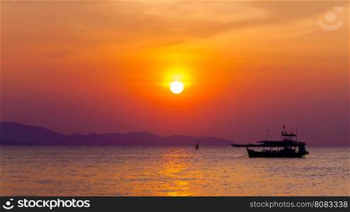 Beautiful landscape. sunset on the beach with fishing boat