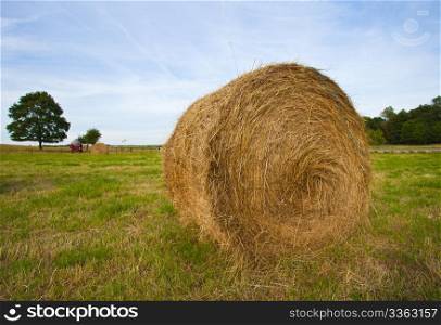 Beautiful landscape view of a farmland with hay bales