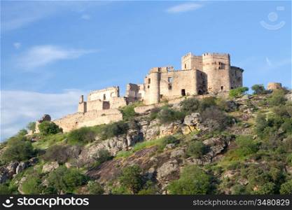 Beautiful landscape with a castle on a hill and a blue sky
