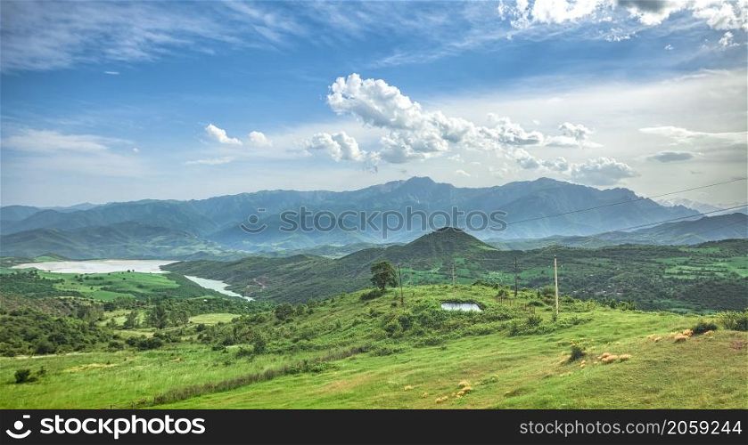 Beautiful landscape with green mountains and magnificent cloudy sky. Exploring Armenia. landscape with mountains and sky