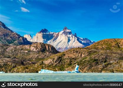 Beautiful landscape with Iceberg floating in the lake grey infront of the beautiful mountain at Torres del Paine National Park in Chile