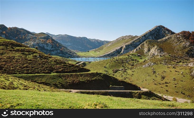Beautiful landscape with lake between mountains on a sunny day. Landscape with lake between mountains
