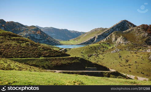 Beautiful landscape with lake between mountains on a sunny day. Landscape with lake between mountains