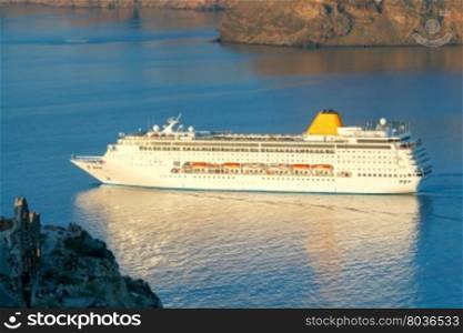 Beautiful landscape with sea and passenger ship near island Nea Kameni. Santorini, Greece.