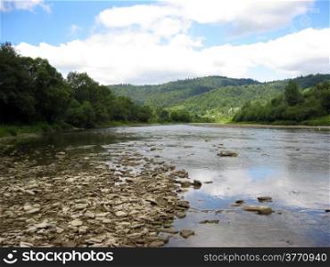 beautiful landscape with speed river in Carpathian mountains