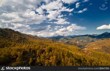 Beautiful landscape with trees and clouds in mountains. Mountain sky trees