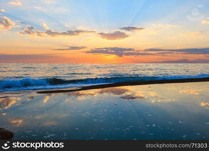 Beautiful landscape with tropical sea sunset on the beach. Picturesque sky reflection in water.