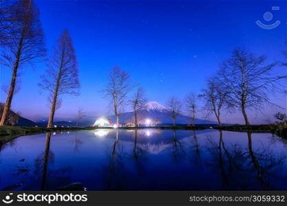 Beautiful landscapes view fuji mountain Fumotoppara Camping Grounds at night in Fujinomiya, Shizuoka, Japan.