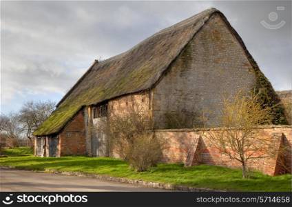 Beautiful, large Cotswold barn with thatched roof, Blackwell, Gloucestershire, England.