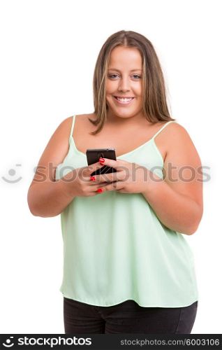 Beautiful large woman at the phone, isolated over white