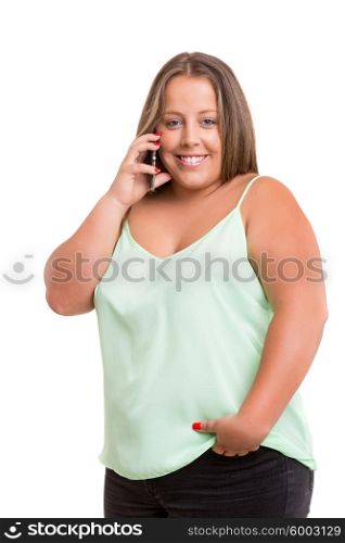 Beautiful large woman at the phone, isolated over white