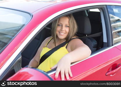 Beautiful large woman driving a red sports car