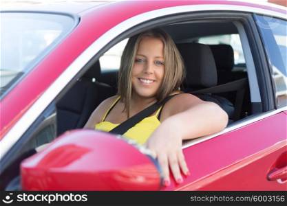 Beautiful large woman driving a red sports car