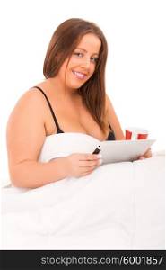 Beautiful large woman relaxing on her bed