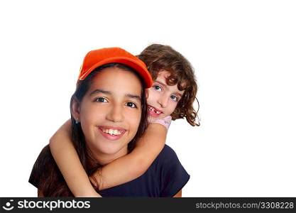 Beautiful Latin teen hispanic girl with little friend smiling isolated on white
