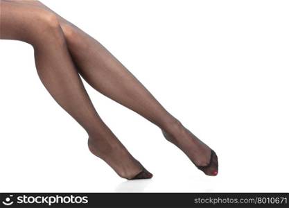 Beautiful legs of slim girl. Beauty woman legs in black tights. Part body of slim attractive girl wearing pantyhose isolated on white.