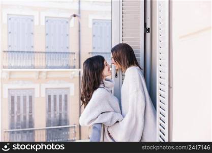 beautiful lesbian couple posing terrace