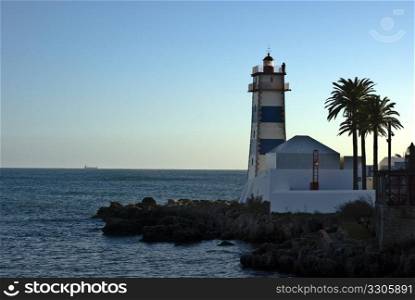 beautiful lighthouse in the harbor of Cascais