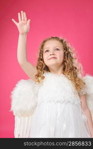 Beautiful little angel girl isolated on pink background